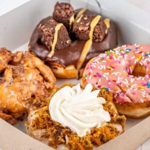 An image of an assorted box of 4 donuts from machinodonuts