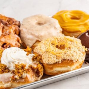 An image of a half dozen gourmet donuts from machino donuts in Toronto Canada