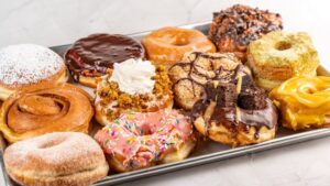 An image of a dozen gourmet donuts from machino donuts in Toronto Canada