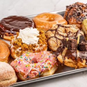 An image of a dozen gourmet donuts from machino donuts in Toronto Canada